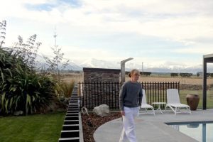 Fairlie Swimming Pool Area person walking beside pool Fairlie Swimming Pool Area person walking beside pool