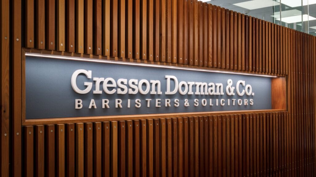 illuminated sign behind reception desk Gresson Dorman